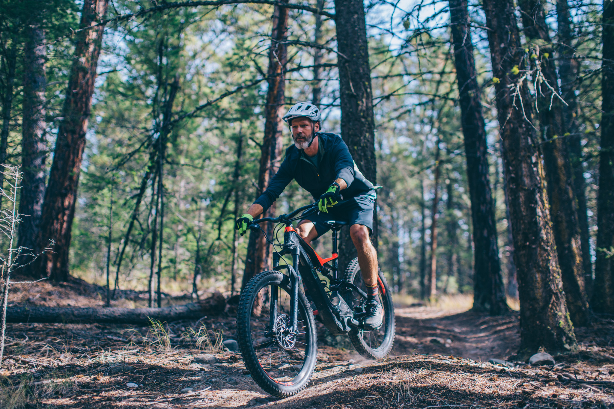 Rider enjoying an e‑bike ride through the forest